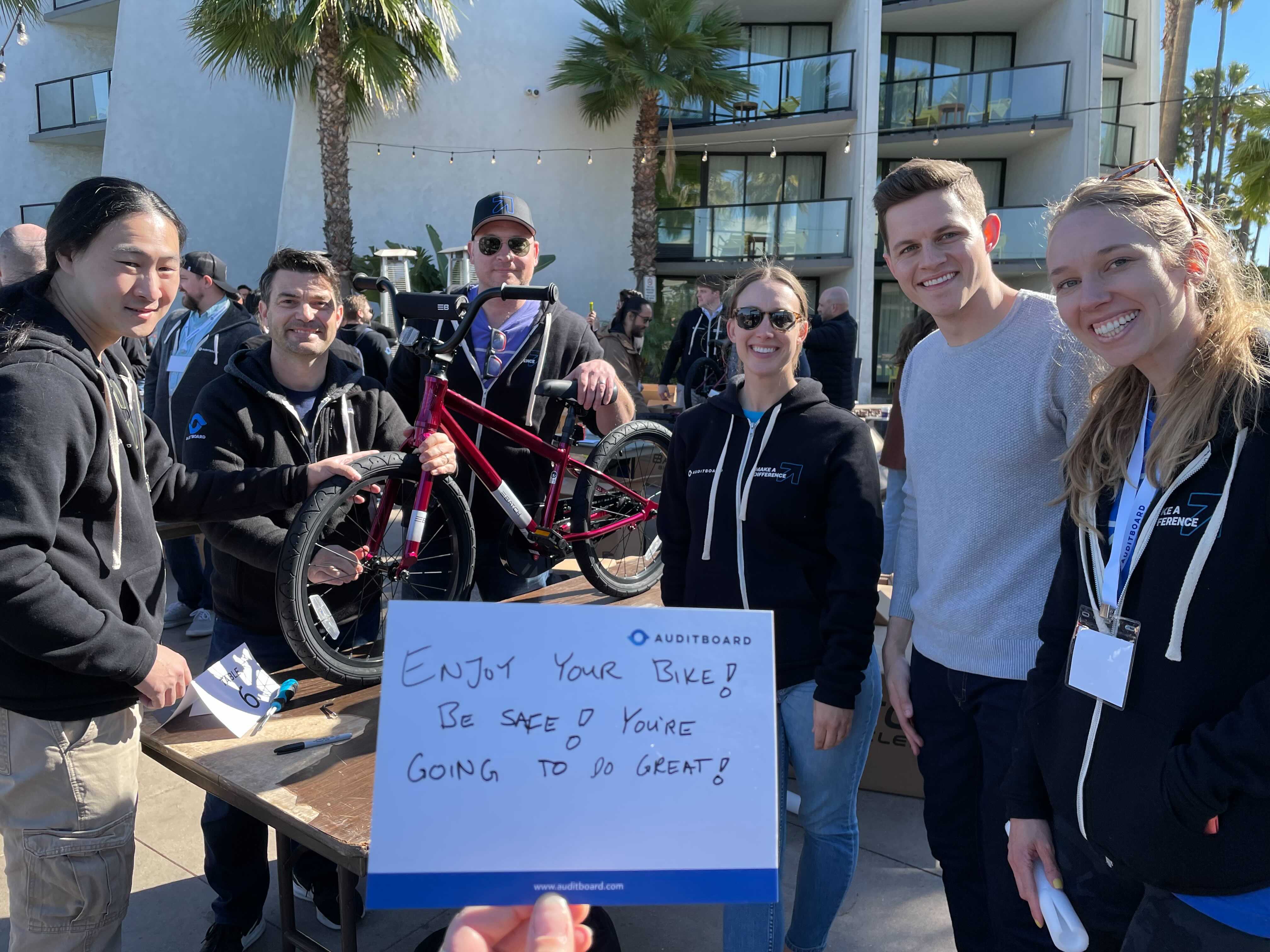 AuditBoard employees build bikes with handwritten notes for children from immigrant families